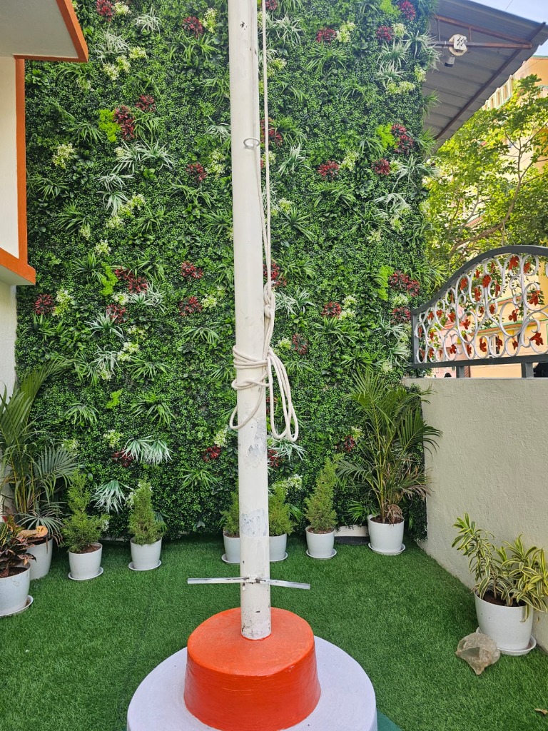 Campus Flagpole and Green Wall